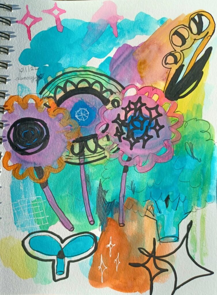 A watercolor, pencil, and paint marker piece in a sketchbook. It has large washes of color, with three mandala-like flowers, a head of broccoli, and a sprouting seed on top.