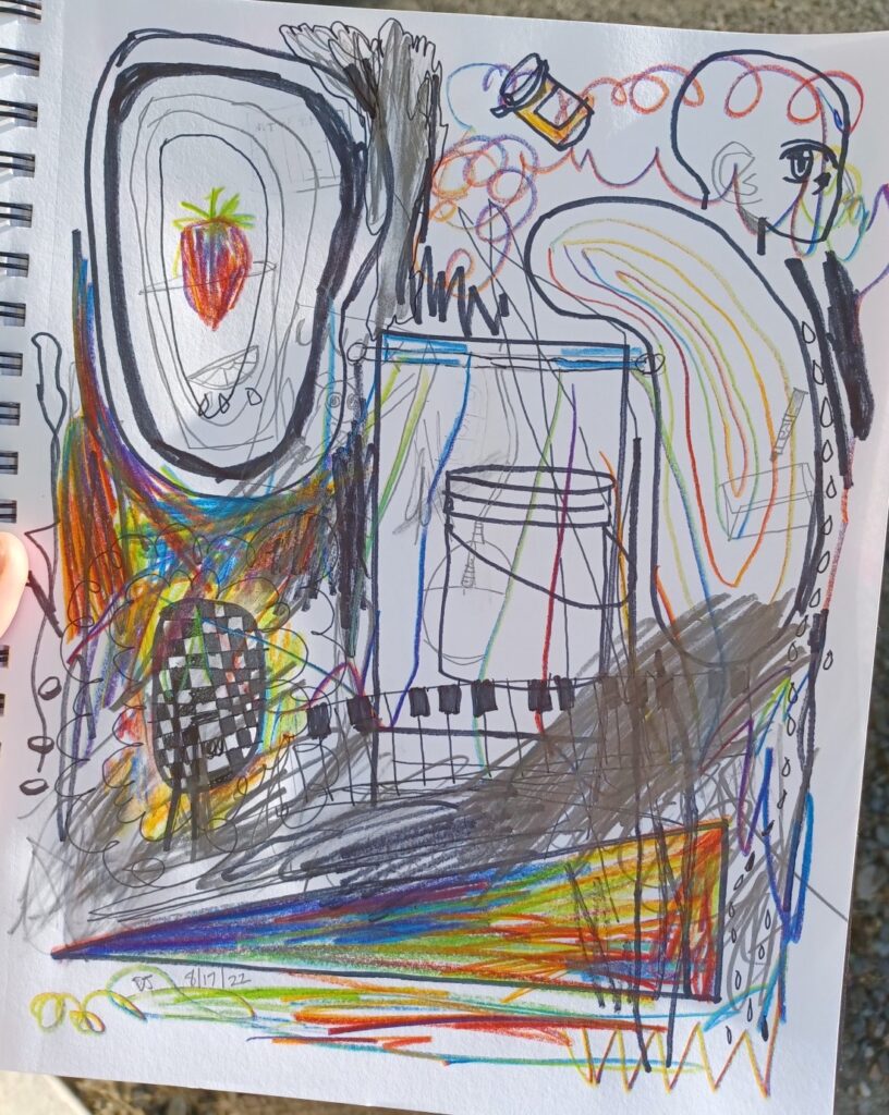 A very scribbly sketchbook page in graphite and rainbow pencil. There is a bucket, a piano, and a strawberry.