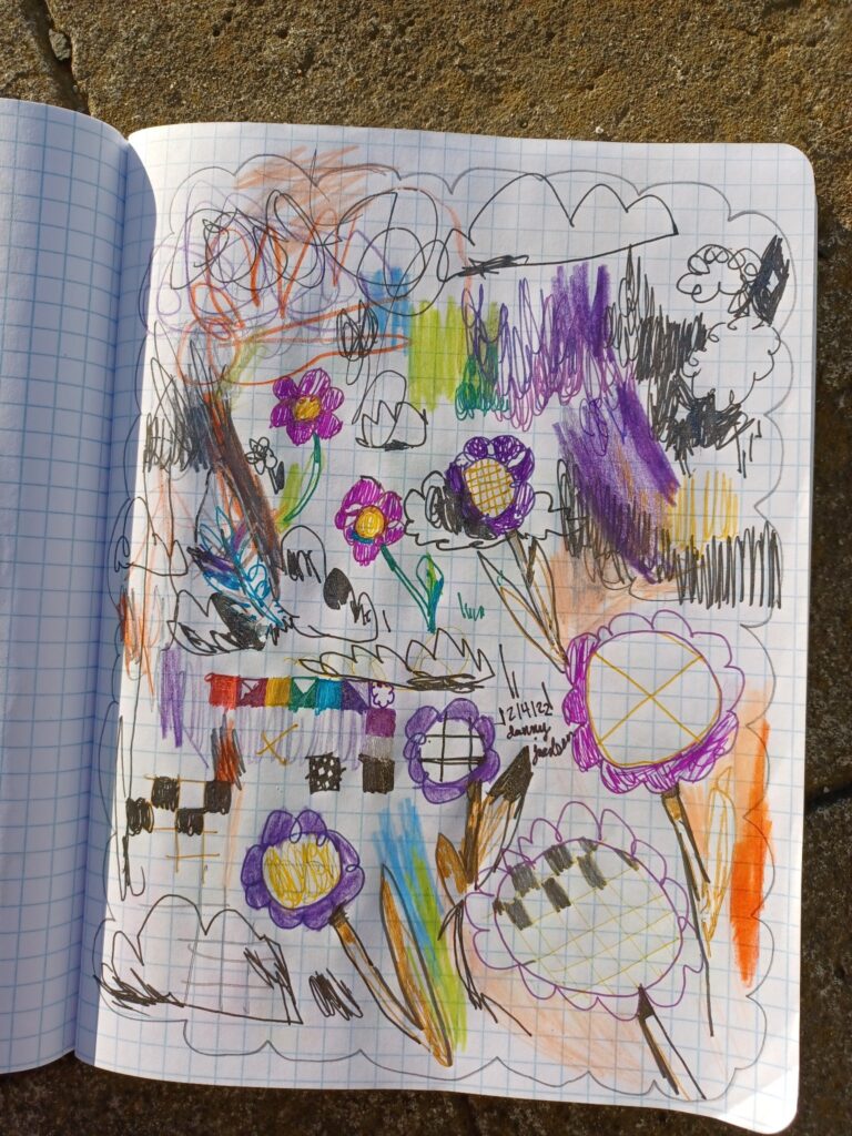 A mixed-media doodle page on graph paper with lots of flowers and checkerboard.